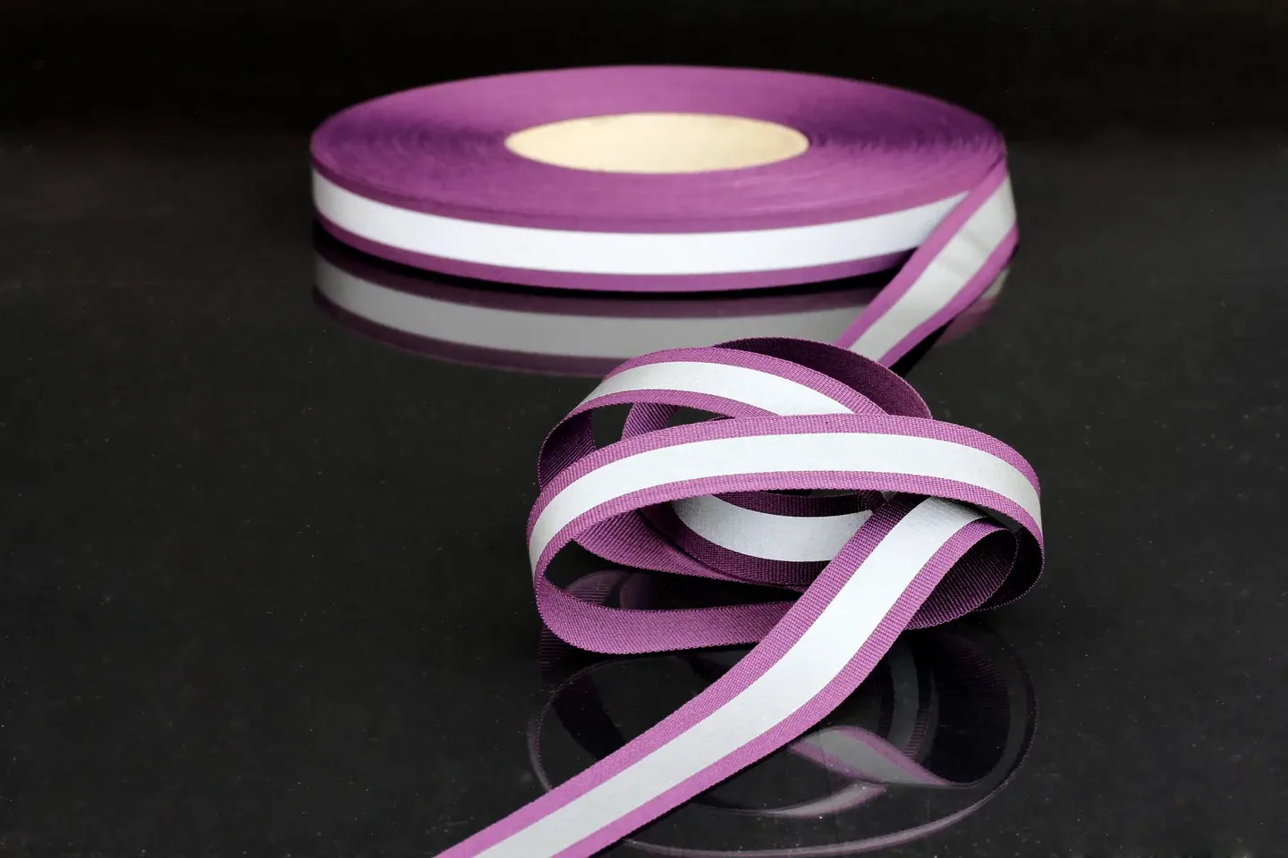 Purple textile webbing with light reflective belt